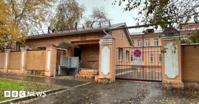 A view of the entrance to the grounds of the anti-plague institute in the Russian city of Irkutsk, with red-brick buildings visible behind a gate, 6 October 2026