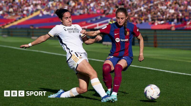 Oihane Hernandez of Real Madrid competes for the ball with Ona Batlle of FC Barcelona during a November 2023 Liga F match
