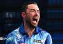 Luke Humphries celebrates beating Gerwyn Price to win the World Grand Prix