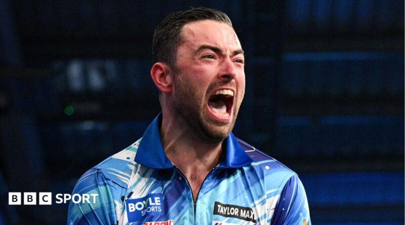 Luke Humphries celebrates beating Gerwyn Price to win the World Grand Prix
