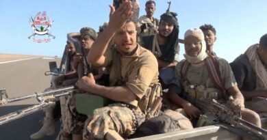 Yemeni government fighters recorded driving vehicles over Houthi opponents
