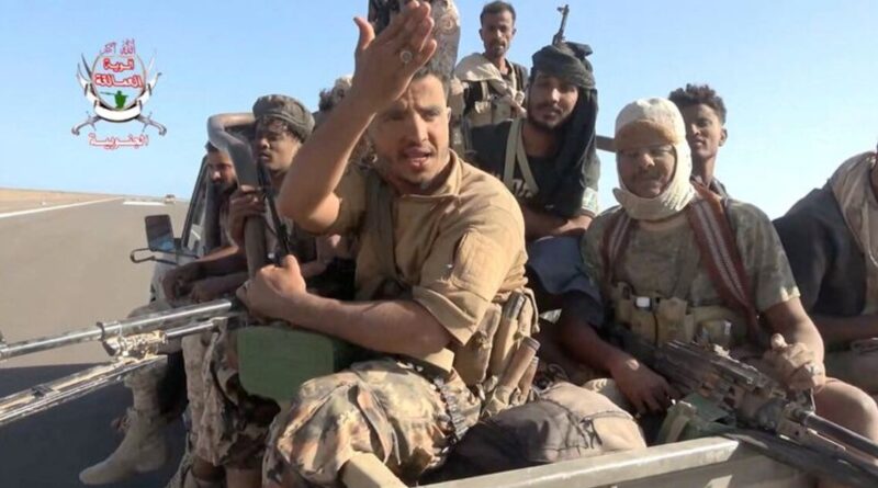 Yemeni government fighters recorded driving vehicles over Houthi opponents